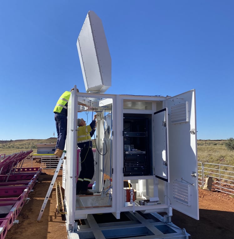 A MAX avian radar being installed on top of a micro shelter