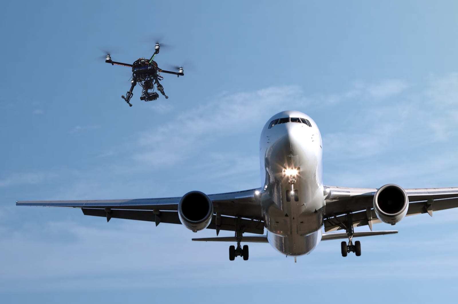 Small drone flying near a commercial aircraft on final approach